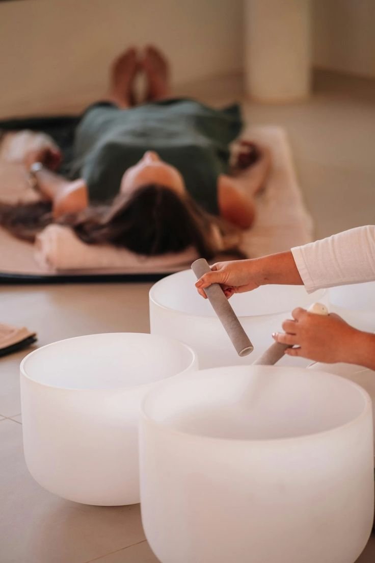 Crystal singing bowls arranged for a group sound bath.